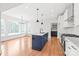 Open-concept kitchen featuring a blue island, granite countertops, and stainless steel appliances at 3646 46Th Ne Ave, Hickory, NC 28601