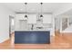 Bright kitchen with a central island, stainless steel appliances, and white cabinets for a clean aesthetic at 3646 46Th Ne Ave, Hickory, NC 28601