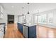 Modern kitchen with granite countertops, stainless steel appliances, and an island with pendant lighting at 3646 46Th Ne Ave, Hickory, NC 28601