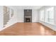 Spacious living room with a fireplace, large windows, and a staircase leading to the upper level at 3646 46Th Ne Ave, Hickory, NC 28601