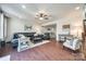 Bright and airy living room featuring hardwood floors, a ceiling fan, and neutral paint at 469 Hawks Creek Pkwy, Fort Mill, SC 29708