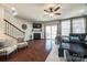 Cozy living room with a fireplace, hardwood floors, and a sliding glass door at 469 Hawks Creek Pkwy, Fort Mill, SC 29708