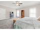 Bright main bedroom with a ceiling fan, soft carpet, and natural light at 491 Stonemarker Rd, Mooresville, NC 28117