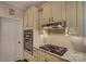 Kitchen showcasing stainless steel appliances, granite countertops, and a gas stovetop at 5002 Stonehill Ln, Matthews, NC 28104