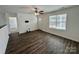 Open-concept living room with modern flooring, neutral walls, and a view into the entrance and window at 514 Meadowrock Dr, Albemarle, NC 28001