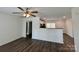 Open-concept living room with modern flooring, neutral walls, and a view into the bright kitchen at 514 Meadowrock Dr, Albemarle, NC 28001