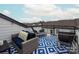 Relaxing rooftop deck with comfortable seating and neighborhood views, perfect for outdoor entertainment at 613 Tudor Park Way, Charlotte, NC 28211