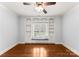Bright bedroom featuring hardwood floors, window seat, and built-in bookshelves at 706 Eagle Point Ct, Weddington, NC 28104