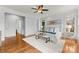 Bright bedroom with hardwood floors and white walls at 706 Eagle Point Ct, Weddington, NC 28104