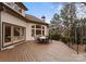 Wooden deck with outdoor seating overlooking the backyard and trees at 706 Eagle Point Ct, Weddington, NC 28104