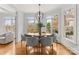 Elegant dining area with natural light and views of the landscaped backyard and lake at 706 Eagle Point Ct, Weddington, NC 28104