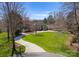 Impressive home showcasing lush lawn and a circular driveway leading to a grand entrance, set on a sprawling lot at 706 Eagle Point Ct, Weddington, NC 28104