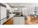 Large kitchen boasts stainless appliances, a central island, and an adjacent sunlit dining space at 706 Eagle Point Ct, Weddington, NC 28104