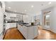 Open kitchen with stainless steel appliances, center island and connecting breakfast room at 706 Eagle Point Ct, Weddington, NC 28104