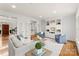 Bright living room with hardwood floors, stylish furniture, and a custom built-in entertainment center at 706 Eagle Point Ct, Weddington, NC 28104