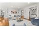 Bright living room with hardwood floors, neutral furnishings, and multiple doors leading to other rooms in the home at 706 Eagle Point Ct, Weddington, NC 28104