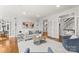 Inviting living room featuring hardwood floors, neutral tones, and elegant French doors at 706 Eagle Point Ct, Weddington, NC 28104