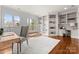 Home office space with built in shelves and desk, and lots of natural light at 706 Eagle Point Ct, Weddington, NC 28104