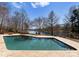 Inviting backyard pool with flagstone decking, offering serene water views and a tranquil setting at 706 Eagle Point Ct, Weddington, NC 28104
