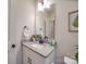Cozy half bathroom boasts a granite countertop vanity and modern fixtures at 711 E 3Rd Ave, Gastonia, NC 28054