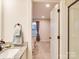 Bright bathroom with granite countertop, modern fixtures, and convenient access to the bedroom at 711 E 3Rd Ave, Gastonia, NC 28054