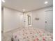 Cozy bedroom features carpet, a floral comforter and access to a walk-in closet and bathroom at 711 E 3Rd Ave, Gastonia, NC 28054
