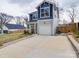 Beautiful two-story home with a garage, driveway, and landscaped front yard at 711 E 3Rd Ave, Gastonia, NC 28054