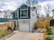 Charming two-story home featuring a garage, driveway, and landscaped front yard at 711 E 3Rd Ave, Gastonia, NC 28054