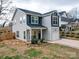 Charming two-story home features a well-maintained lawn and landscaped front yard at 711 E 3Rd Ave, Gastonia, NC 28054
