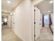 Upstairs hallway featuring access to multiple bedrooms and ample lighting at 711 E 3Rd Ave, Gastonia, NC 28054