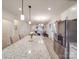 Well-lit kitchen features stainless steel appliances, an island with bar seating, and an open layout at 711 E 3Rd Ave, Gastonia, NC 28054