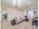 Spacious living room is filled with natural light, featuring a large sofa and stylish decor at 711 E 3Rd Ave, Gastonia, NC 28054