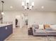 Comfortable living room boasts an open floor plan that connects to an adjacent kitchen at 711 E 3Rd Ave, Gastonia, NC 28054