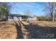 Spacious backyard with a deck and ample space for outdoor activities at 7209 Tressel Ln, Mint Hill, NC 28227
