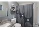 Bathroom featuring a sink with vanity, a toilet, and a shower with curtain at 7209 Tressel Ln, Mint Hill, NC 28227