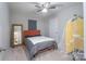 Bedroom with a ceiling fan, window, and orange headboard bed at 7209 Tressel Ln, Mint Hill, NC 28227