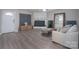 Comfortable living area with a stylish fireplace, a cozy couch, and ample natural light at 7209 Tressel Ln, Mint Hill, NC 28227
