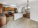 A well-equipped kitchen features stainless appliances, wood cabinetry, tile floors, and an open layout at 111 Charterhouse Ln, Fort Mill, SC 29715