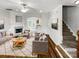 Bright living room featuring a fireplace, hardwood floors, and an open layout, perfect for entertaining and relaxing at 111 Charterhouse Ln, Fort Mill, SC 29715