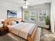 Serene main bedroom with neutral tones, a large window, and a comfortable bed, creating a peaceful retreat at 111 Charterhouse Ln, Fort Mill, SC 29715