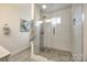 Modern bathroom with a glass-enclosed shower and stylish tile at 119 N Smallwood Pl, Charlotte, NC 28216