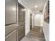Long hallway with hardwood floors and gray trim at 119 N Smallwood Pl, Charlotte, NC 28216