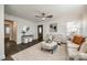 Spacious living room with ceiling fan, hardwood floors, and bright, natural light at 119 N Smallwood Pl, Charlotte, NC 28216