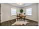 Bright office space featuring a wooden desk, hardwood floors, and crisp white walls at 119 N Smallwood Pl, Charlotte, NC 28216