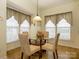 Cozy dining area with a glass table, four chairs, and large windows at 120 Snead Rd, Fort Mill, SC 29715