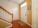 Bright entryway featuring hardwood floors, stairs to the upper level, and a coat closet at 120 Snead Rd, Fort Mill, SC 29715