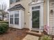 Close-up of the front door with decorative trim and a small brick porch area at 120 Snead Rd, Fort Mill, SC 29715