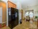 Charming kitchen with tile flooring, black refrigerator, and adjacent dining area at 120 Snead Rd, Fort Mill, SC 29715
