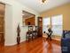 Comfortable living room featuring wood floors, a grandfather clock, and a breakfast bar at 120 Snead Rd, Fort Mill, SC 29715