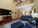 Well lit living room with a view to the second story and open concept to kitchen at 120 Snead Rd, Fort Mill, SC 29715